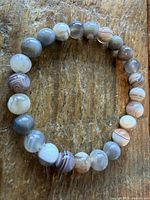 Full view of the circular bracelet highlighting bead colors and banding