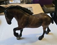 Left side view of brown Breyer horse figurine