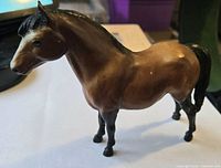 Left front view of bay Breyer Traditional model horse