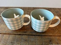 Two gingham mugs side by side