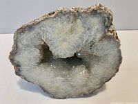 Front view showing polished face and crystal cavity