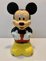 Front view of Mickey Mouse coin bank showing overall appearance
