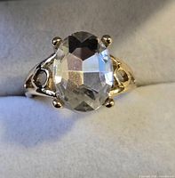 Gold-tone ring with clear oval stone front view