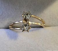 Ring angled to show split shank and twin stones