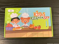 Front of boxed Kids Kitchen Set showing branding and age range