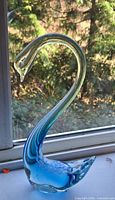 Full view of glass swan showing shape and color gradient