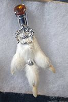 Front view of Scottish thistle kilt pin with amber stone and fur foot