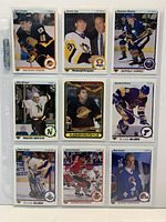 Nine hockey rookie cards in a 3×3 sleeve showing players Larionov, Jagr, Mogilny, Modano, Krutov, Brind’Amour, Joseph, Roenick, Sundin