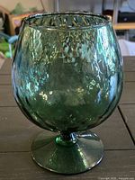 Front view of green textured stemmed decorative glass