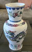 Front view of porcelain dragon vase showing motif and shape
