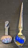 Letter opener and bottle opener side by side showing full length and handles