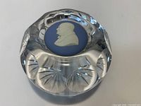 Oblique view showing blue cameo inset and surrounding faceted glass