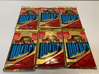 Six sealed 1993-94 O-Pee-Chee Premier booster packs arranged on table