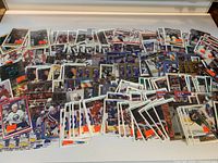 Wide view of entire spread of roughly 300 hockey cards in sleeves
