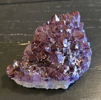 Full view of amethyst cluster front, showing crystal points and coloration