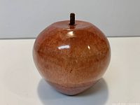 Front view of polished stone apple