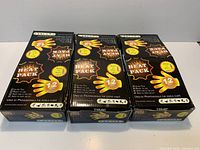 Three sealed TIME heat pack boxes front view