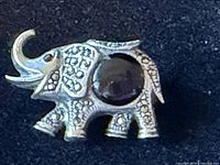 Elephant brooch front view showing onyx body and marcasite detailing