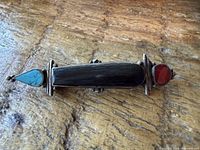 Front view showing onyx, coral, turquoise in silver setting