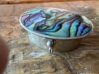 Top view showing abalone inlay and metal body