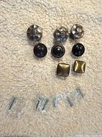 All eight knobs with screws displayed
