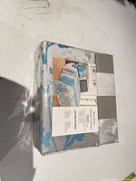 Front of packaged Bamboo Home Luxury sheet set showing brand, size and pattern