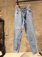 Front view of Buffalo light wash mom jeans hanging
