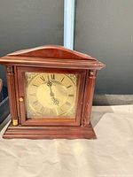 Front view of Bulova mantel clock showing dial, case, and columns