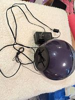 Alarm clock with attached AC adapter, overall view