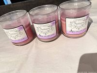 Front view of three Aromabeads Benditaroma Protection jar candles