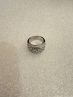 Full view of ring showing width and silver finish