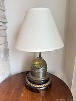 Full view of lamp with shade on wood base
