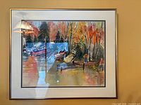 Framed watercolour on wall showing complete artwork