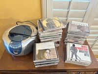 Boombox with stacks of CDs