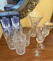 Group shot showing vase, four highball glasses, two candlesticks, two boxed wine glasses