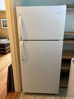 Front view of white Frigidaire top-freezer refrigerator