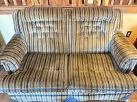 Front view of striped loveseat showing full form and upholstery