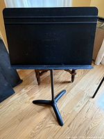 Front view of Manhasset music stand showing desk and branding