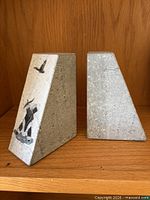 Front view showing motifs on both bookends