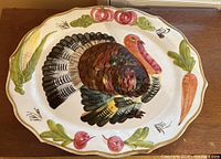 Front view of oval platter showing full turkey and vegetable motif