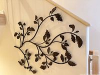 Full view of the bronze metal branch wall art mounted on wall