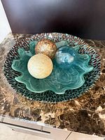Top view of fused glass platter with three decorative spheres