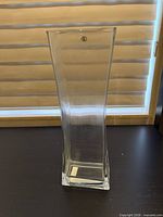 Front view of clear glass square vase