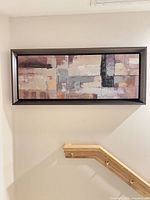 Full view of framed artwork hung on wall showing size and orientation
