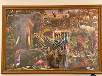 Full view of framed puzzle showing wildlife scene