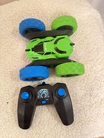 Top view of Hamdi green/blue RC car with 2.4 GHz controller