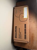 Front of sealed LiftMaster Smart Garage Control box