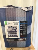 Front of packaged Mainstays bed-in-a-bag showing brand and contents list