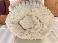 Top view showing entire round faux fur pet bed