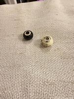 Front view of both beads on fabric background